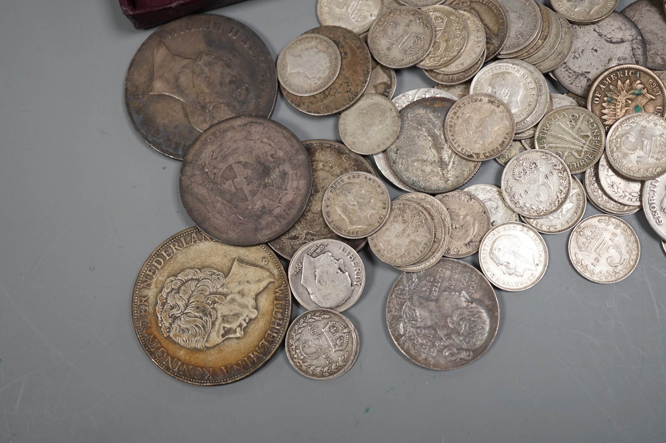 A collection of silver threepences and minor coins